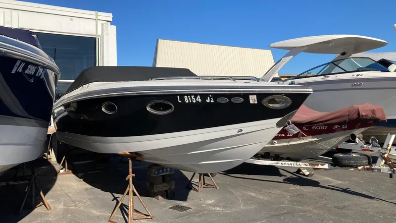 Slide: The Image of 2006 Cobalt 263 boat on stands in a marina. - 3