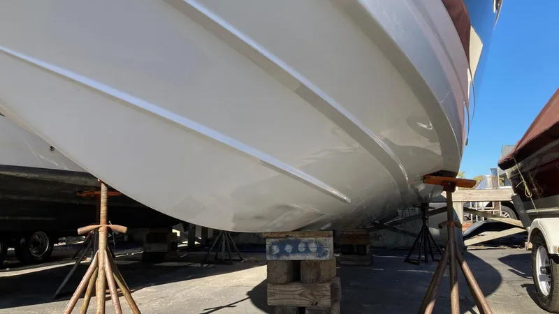 Slide: The Image of 2006 Cobalt 263 boat hull on stands for maintenance. - 4