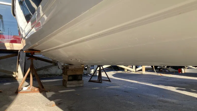 Slide: The Image of 2006 Cobalt 263 boat hull on stands for maintenance. - 8