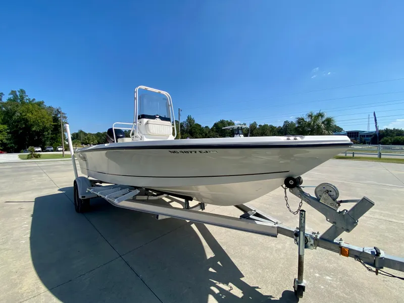Slide: The Image of 2017 Mako 19 CPX boat on trailer in outdoor setting. - 2