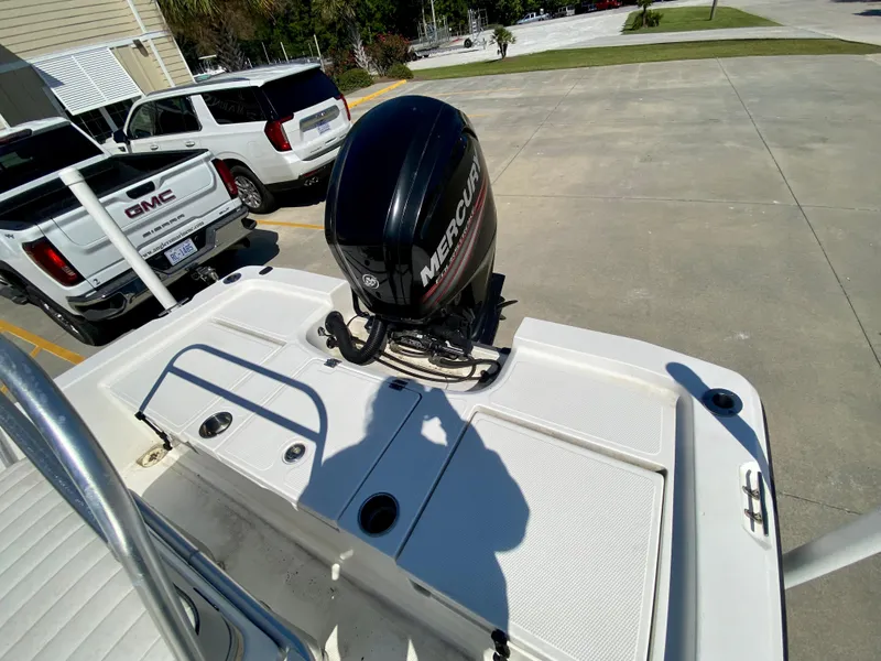 Slide: The Image of 2017 Mako 19 CPX boat with Mercury outboard motor in parking lot. - 5