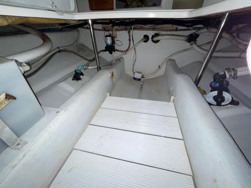 Slide: The Image of 2005 Hunt Yachts Harrier 25 interior showing bilge area and plumbing. - 9