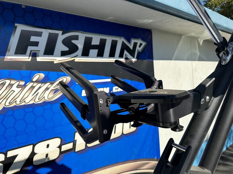 Slide: The Image of Close-up of 2024 Sanger V215 SX boat accessory against a marine store sign. - 22