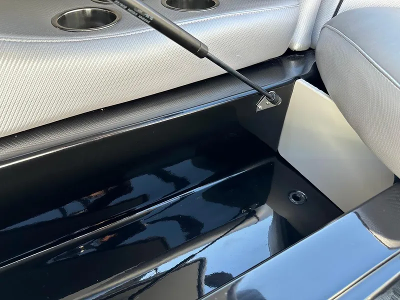 Slide: The Image of 2024 Sanger V215 SX boat interior storage compartment with hydraulic lift. - 31