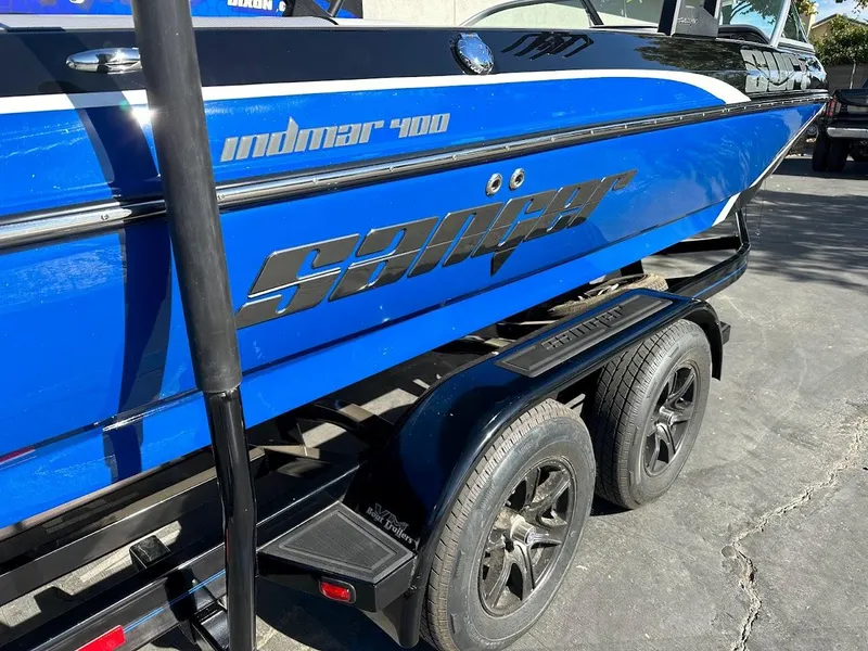 Slide: The Image of 2024 Sanger V215 SX boat with Indmar 400 engine on a trailer. - 9