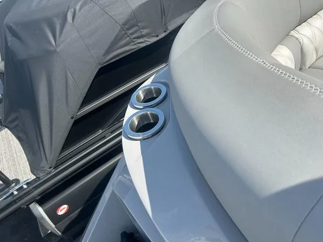 Slide: The Image of 2023 Bennington 25 RFBWA Tritoon with cup holders and cushioned seating. - 21