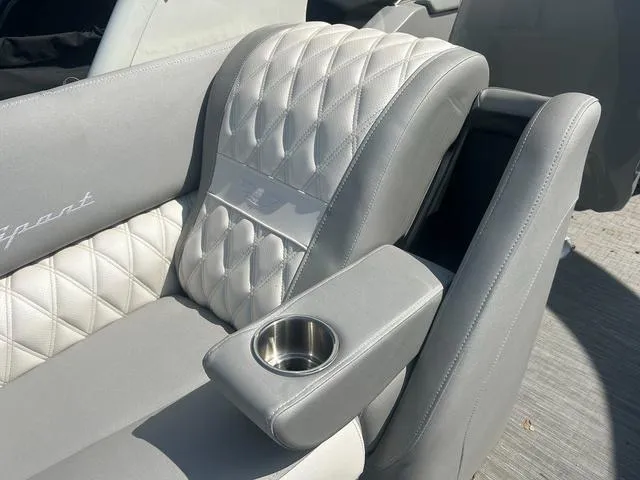 Slide: The Image of Luxurious seating on 2023 Bennington 25 RFBWA Tritoon with quilted upholstery and cup holder. - 22