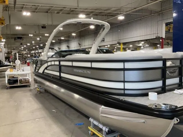 Slide: The Image of 2023 Bennington 25 RFBWA Quad Bench Tritoon in a warehouse. - 4