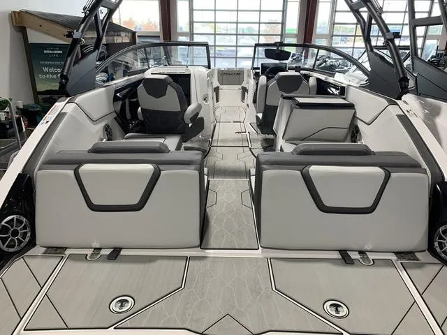 Slide: The Image of 2023 Yamaha Boats 252XE, sleek black and white design, side view. - 4