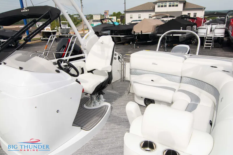 Slide: The Image of 2023 JC NEPTOON 27 TT SPORT boat interior with white seating and helm. - 19