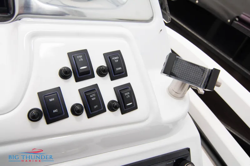 Slide: The Image of Control panel of 2023 JC NEPTOON 27 TT SPORT boat with various switches. - 26