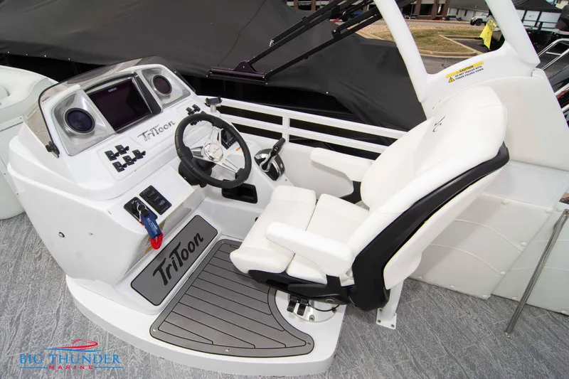 Slide: The Image of 2023 JC NEPTOON 27 TT SPORT boat cockpit with steering wheel and captain's chair. - 31