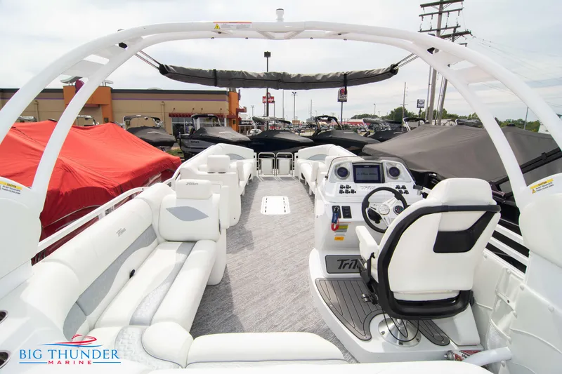 Slide: The Image of 2023 JC NEPTOON 27 TT SPORT boat interior with white seating and modern dashboard. - 39