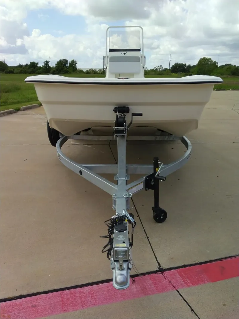 Slide: The Image of 2024 Mako Pro Skiff 19 CC boat on trailer, front view. - 1