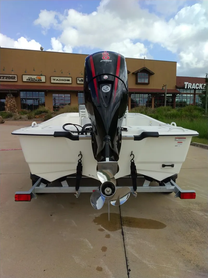 Slide: The Image of 2024 Mako Pro Skiff 19 CC boat on trailer, rear view. - 5