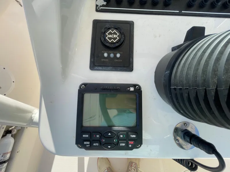 Slide: The Image of 2011 Pursuit 280 Center Console boat control panel with navigation and communication equipment. - 27