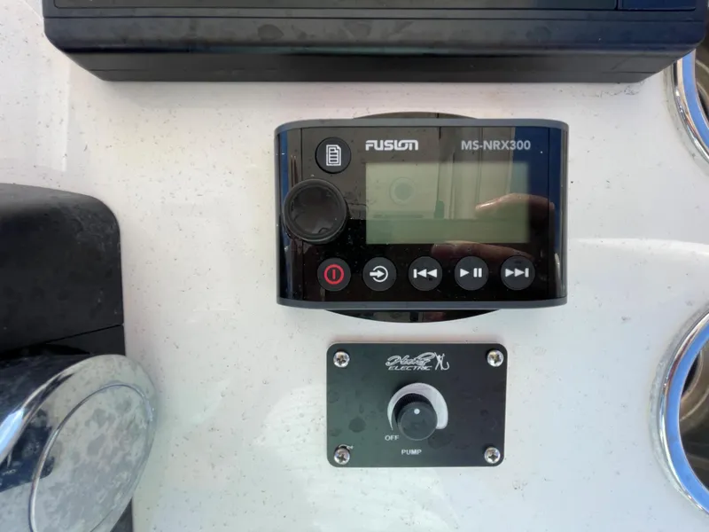 Slide: The Image of Fusion MS-NRX300 control panel on a 2011 Pursuit 280 Center Console boat. - 28
