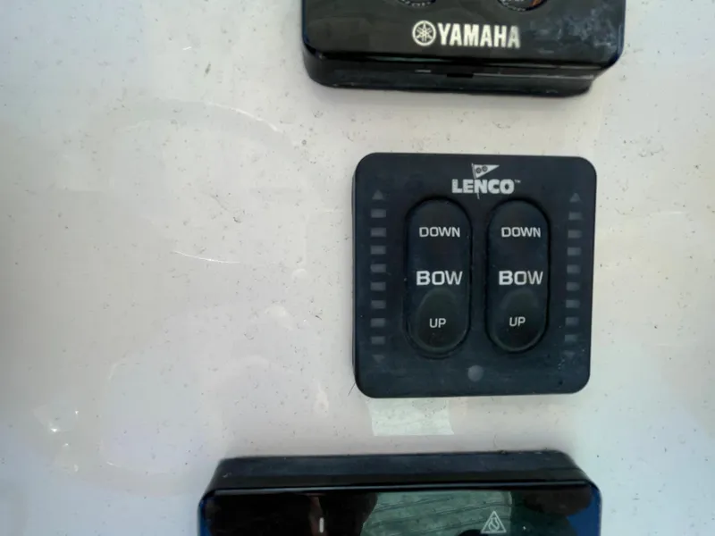Slide: The Image of Lenco trim tab control panel on a 2011 Pursuit 280 Center Console boat. - 29
