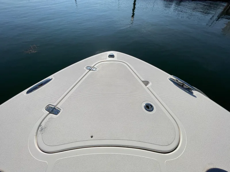 Slide: The Image of 2011 Pursuit 280 Center Console boat bow on calm water. - 40