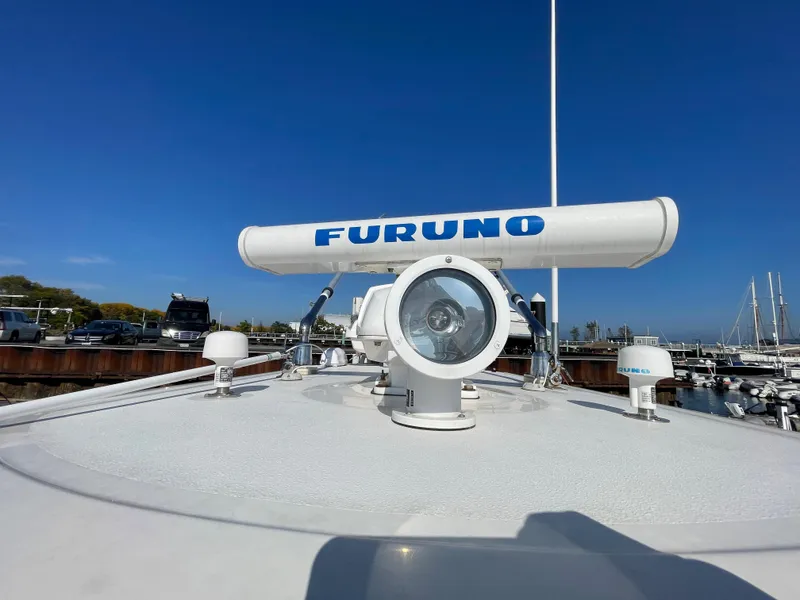 Slide: The Image of 2011 Pursuit 280 Center Console with Furuno radar at marina. - 44