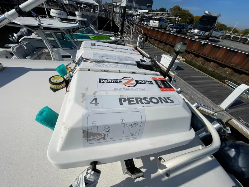 Slide: The Image of 2011 Pursuit 280 Center Console boat with safety equipment for 4 persons. - 45