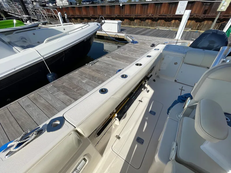Slide: The Image of 2011 Pursuit 280 Center Console boat docked at marina. - 46