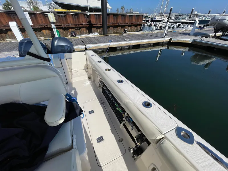 Slide: The Image of 2011 Pursuit 280 Center Console boat docked at marina. - 47