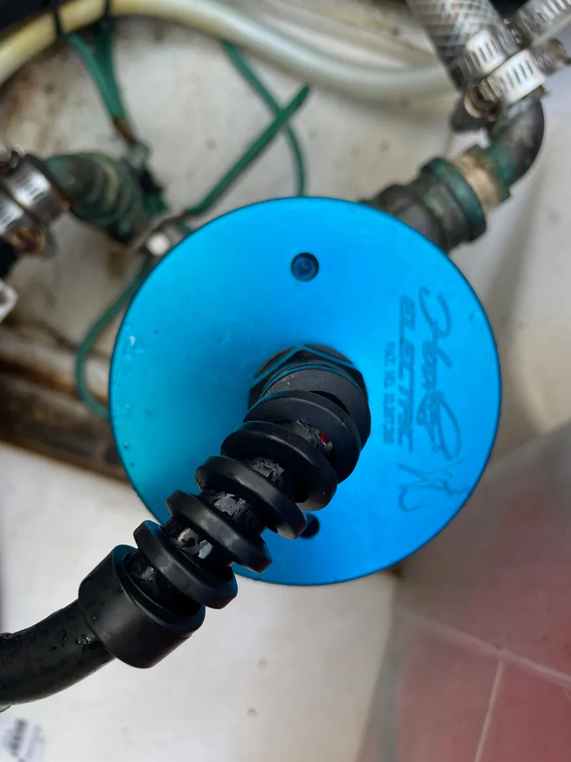 Slide: The Image of Close-up of a 2011 Pursuit 280 Center Console boat's blue electrical component. - 49