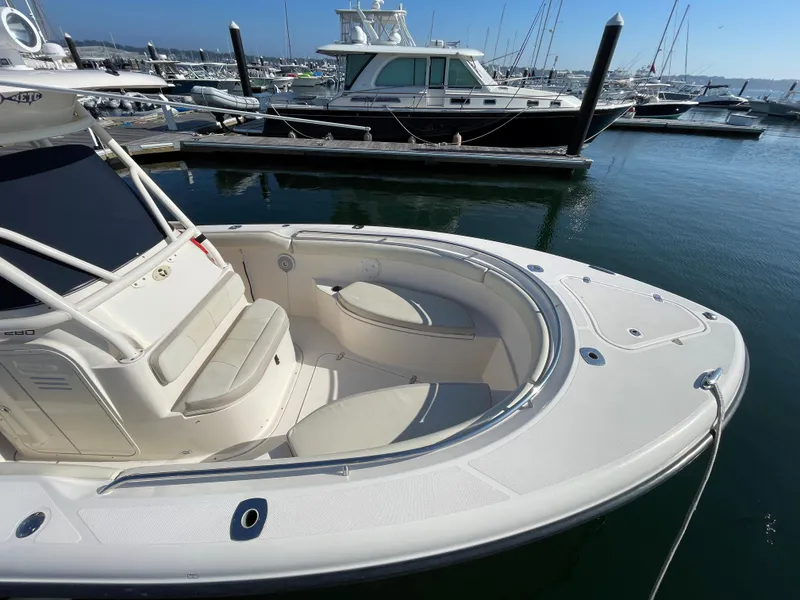 Slide: The Image of 2011 Pursuit 280 Center Console boat docked at a marina. - 5