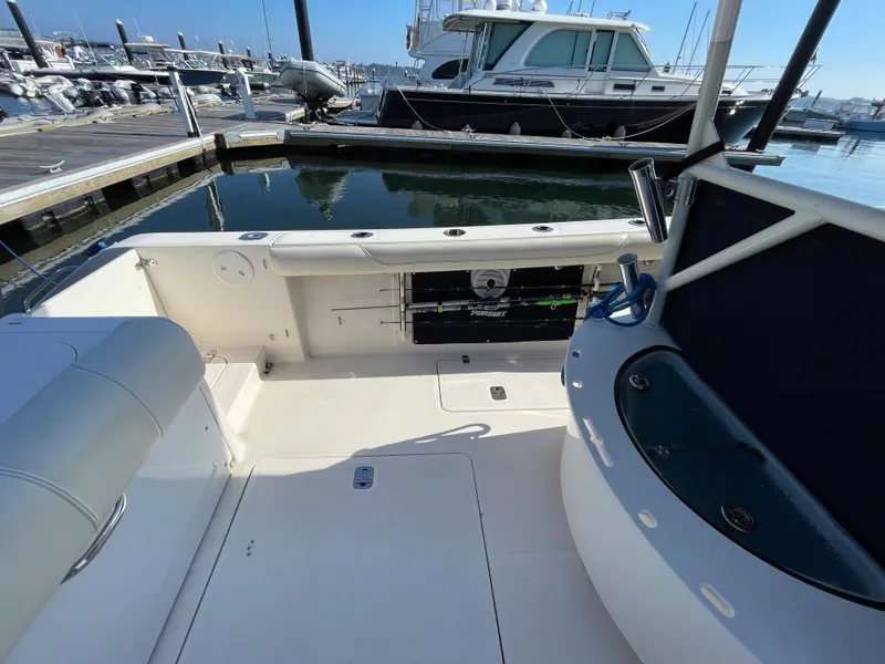 Slide: The Image of 2011 Pursuit 280 Center Console boat docked at marina. - 8