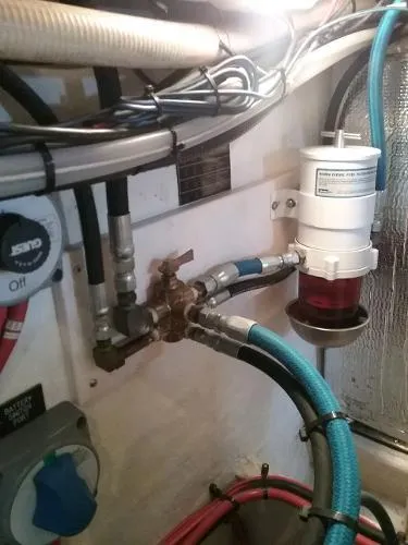 Slide: The Image of Engine room of a 2000 Cruisers Yachts 4450 Express Motoryacht showing fuel filter and hoses. - 33