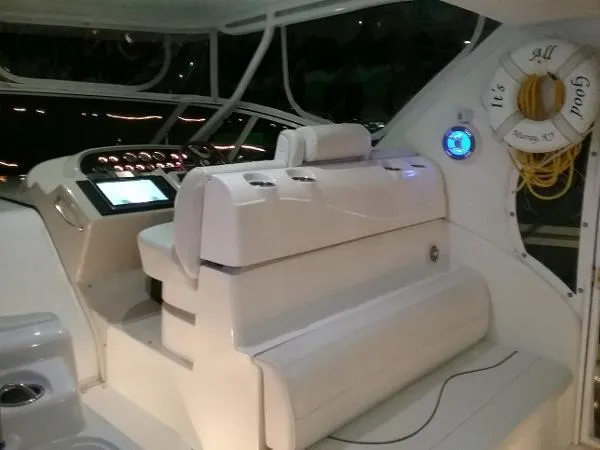 Slide: The Image of 2000 Cruisers Yachts 4450 Express Motoryacht cockpit with helm and seating. - 6