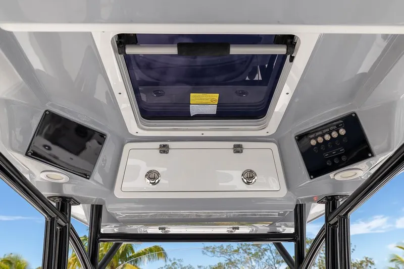 Slide: The Image of 2024 Sea Fox 288 Commander boat interior ceiling with hatch and control panels. - 12