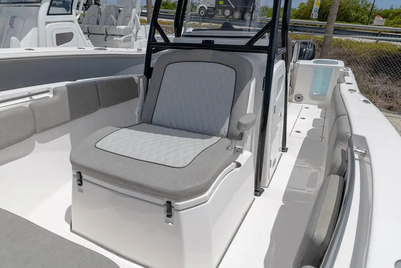 Slide: The Image of 2024 Sea Fox 288 Commander boat interior with cushioned seating and modern design. - 18