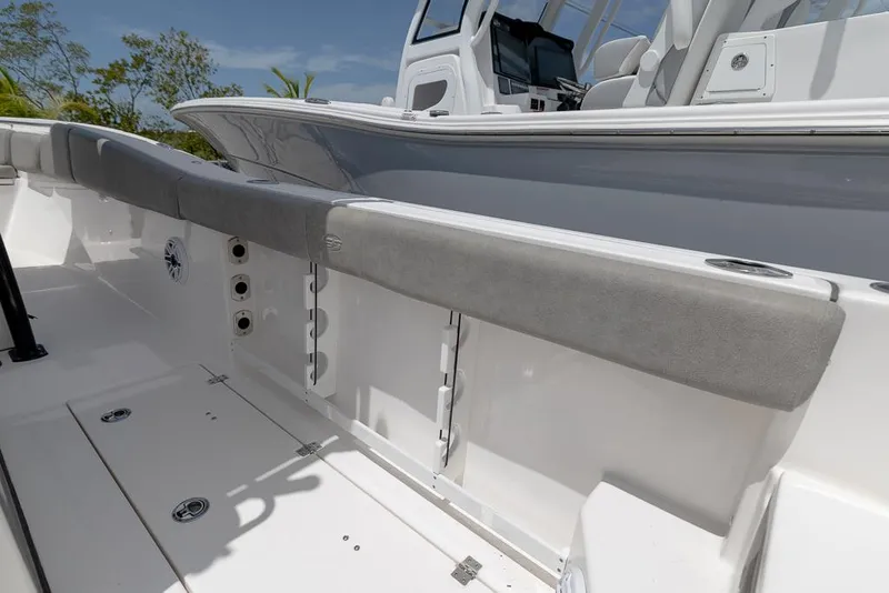 Slide: The Image of 2024 Sea Fox 288 Commander boat interior with cushioned seating and sleek design. - 19