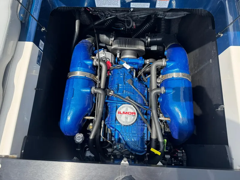 Slide: The Image of 2023 MasterCraft XT23 engine with blue Ilmor components. - 17