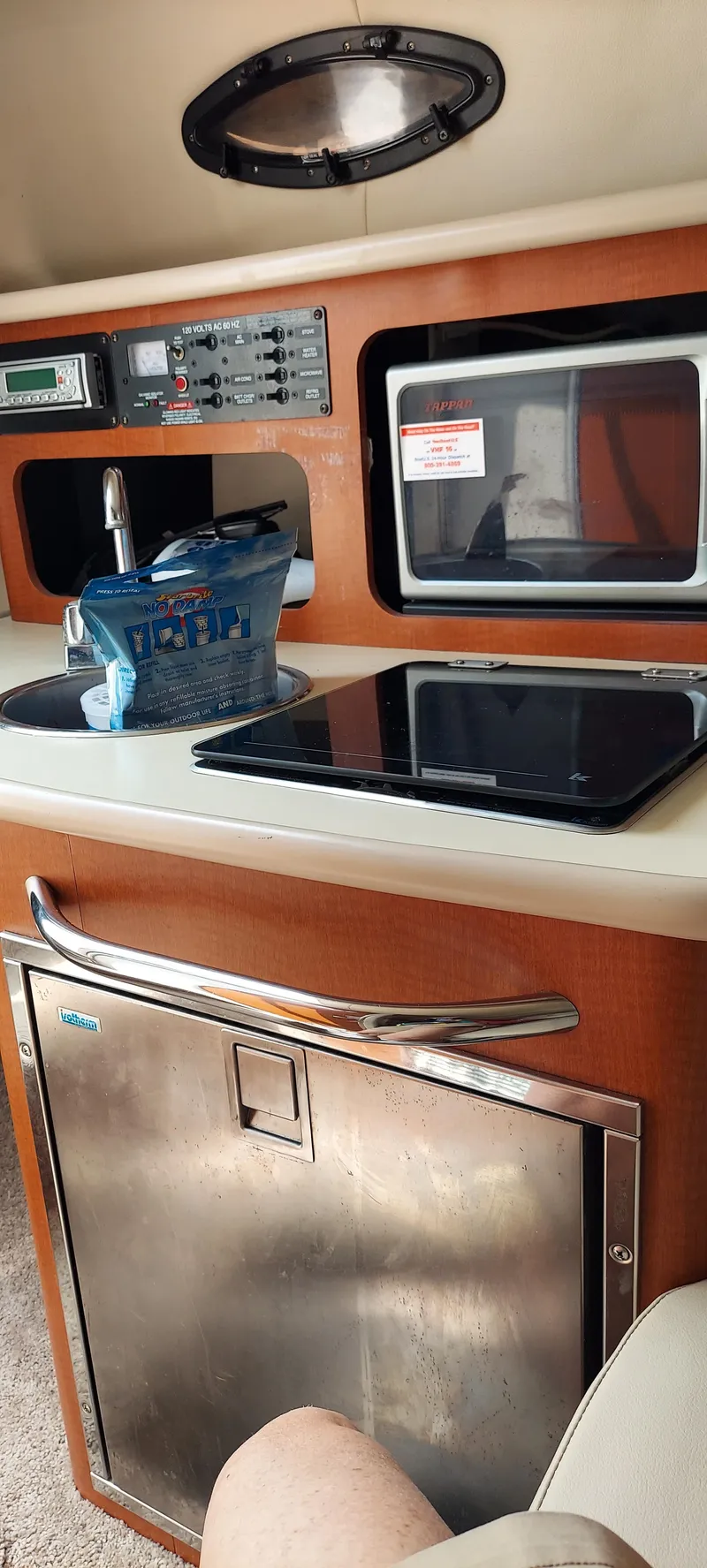 Slide: The Image of Interior of a 2005 Chaparral Signature 240 boat with kitchenette and appliances. - 17