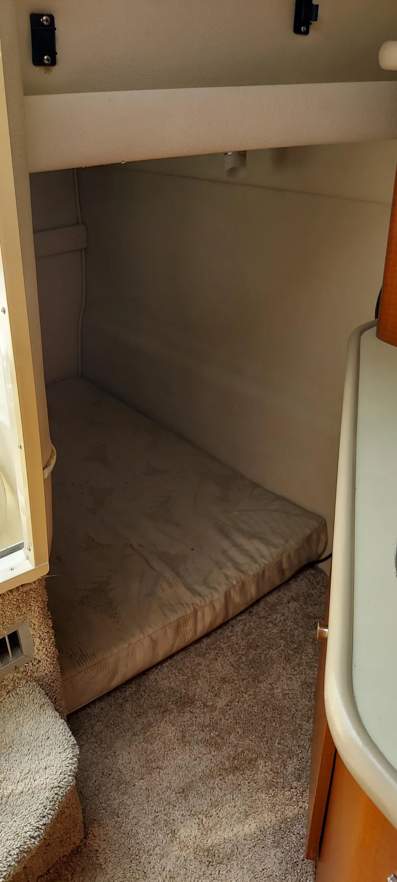 Slide: The Image of Interior sleeping area of a 2005 Chaparral Signature 240 boat. - 22