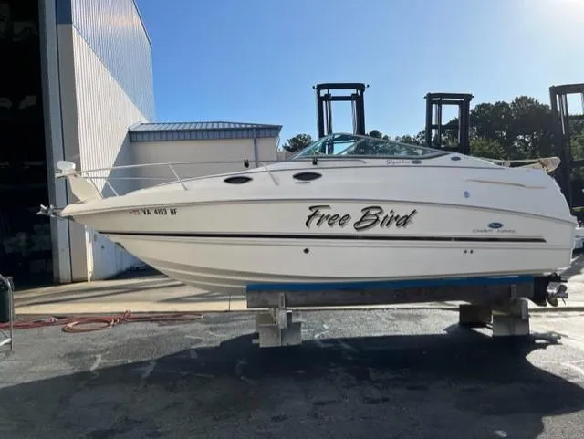 Slide: The Image of 2005 Chaparral Signature 240 boat named Free Bird on a lift in a marina. - 34