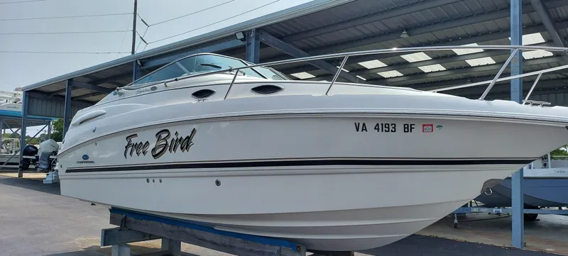 Slide: The Image of 2005 Chaparral Signature 240 boat named Free Bird on a trailer in a covered storage area. - 4