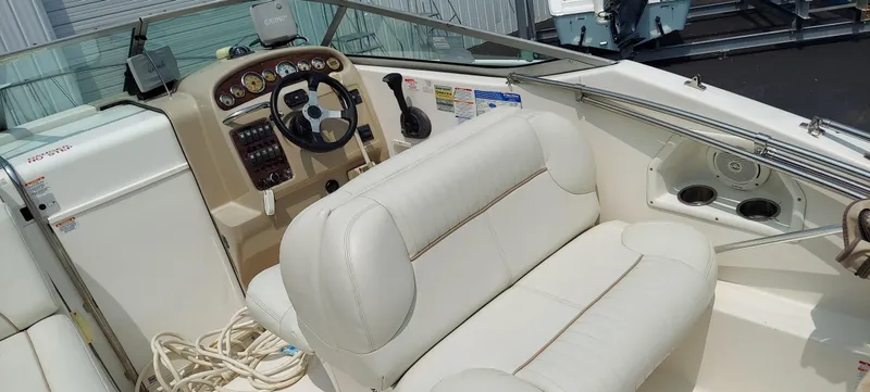 Slide: The Image of 2005 Chaparral Signature 240 boat interior with steering wheel and seating. - 6