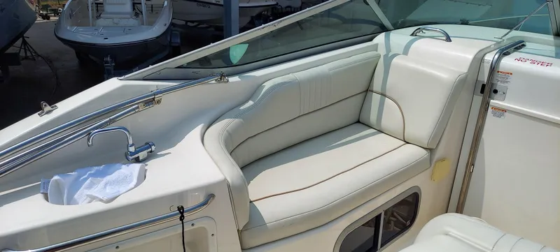 Slide: The Image of 2005 Chaparral Signature 240 boat interior with white leather seating and sink. - 7