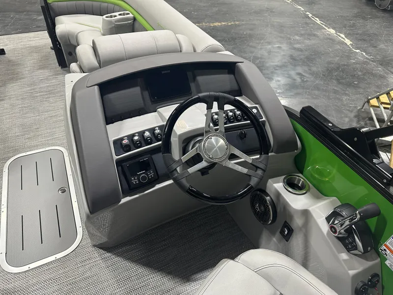 Slide: The Image of 2024 Bennington 24LXS boat interior with steering wheel and control panel. - 12
