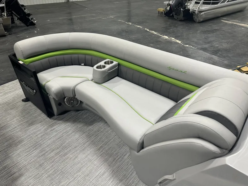 Slide: The Image of 2024 Bennington 24LXS boat interior with gray and green seating. - 15