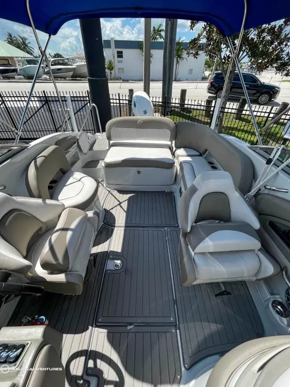 Slide: The Image of 2019 Crownline Eclipse E235 XS boat interior with seating and canopy. - 12