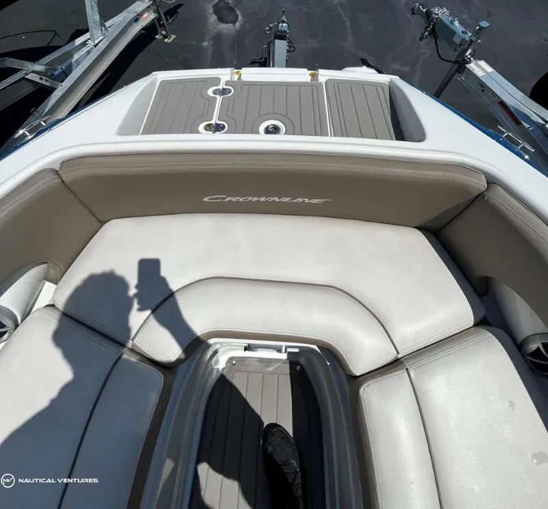 Slide: The Image of 2019 Crownline Eclipse E235 XS boat interior with cushioned seating. - 5