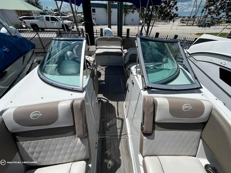 Slide: The Image of 2019 Crownline Eclipse E235 XS boat interior with seating and windshield. - 7