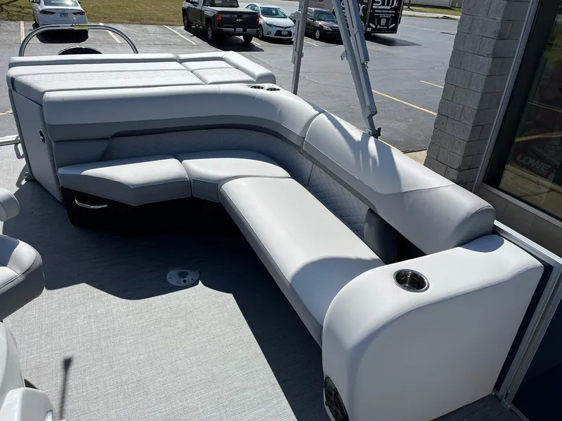 Slide: The Image of 2024 Lowe SS 210 pontoon boat with spacious seating area. - 15
