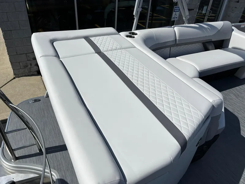 Slide: The Image of 2024 Lowe SS 210 boat with luxurious white seating and diamond stitching. - 16