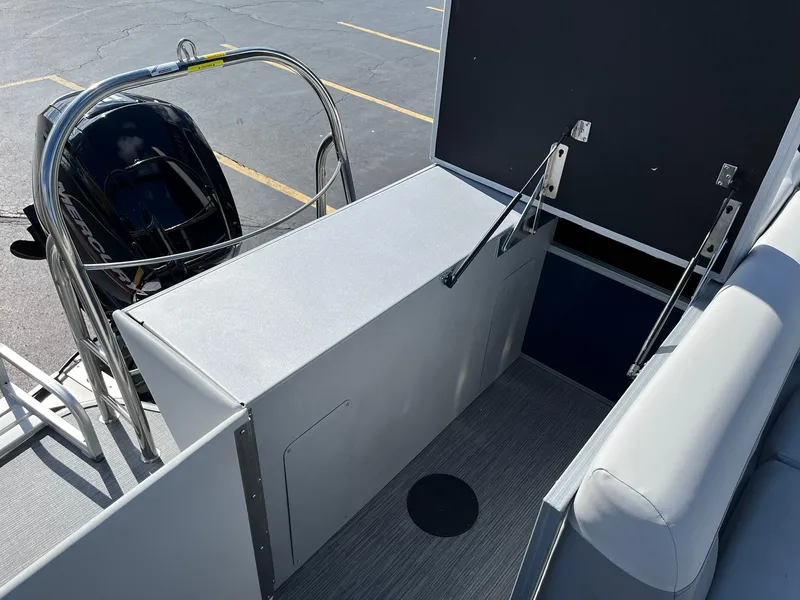 Slide: The Image of 2024 Lowe SS 210 boat rear deck with outboard motor and safety railing. - 17